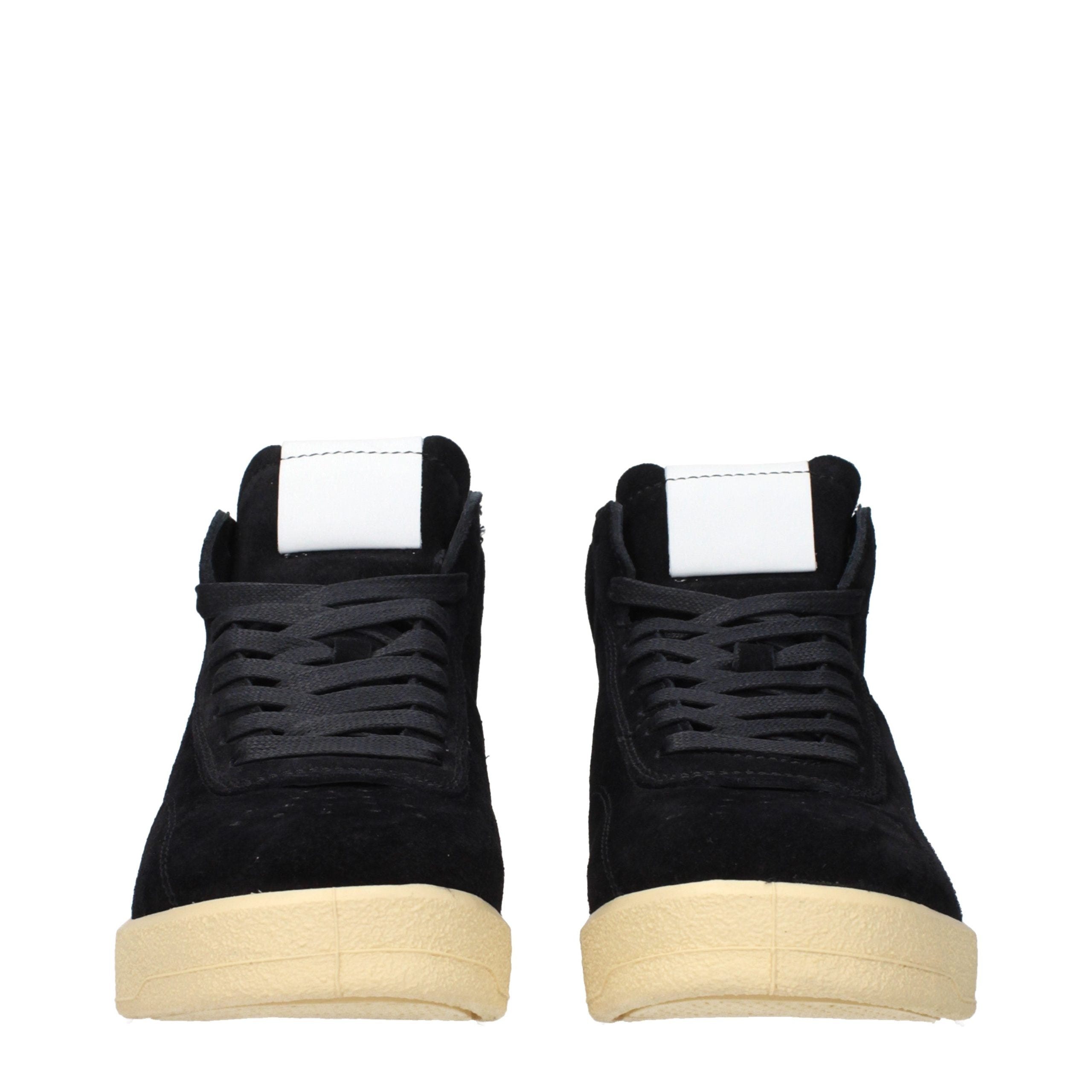 Discover the Jil Sander Black Leather High Top Sneakers, a fusion of exquisite suede and leather, embodying timeless elegance and unparalleled craftsmanship for the discerning individual.