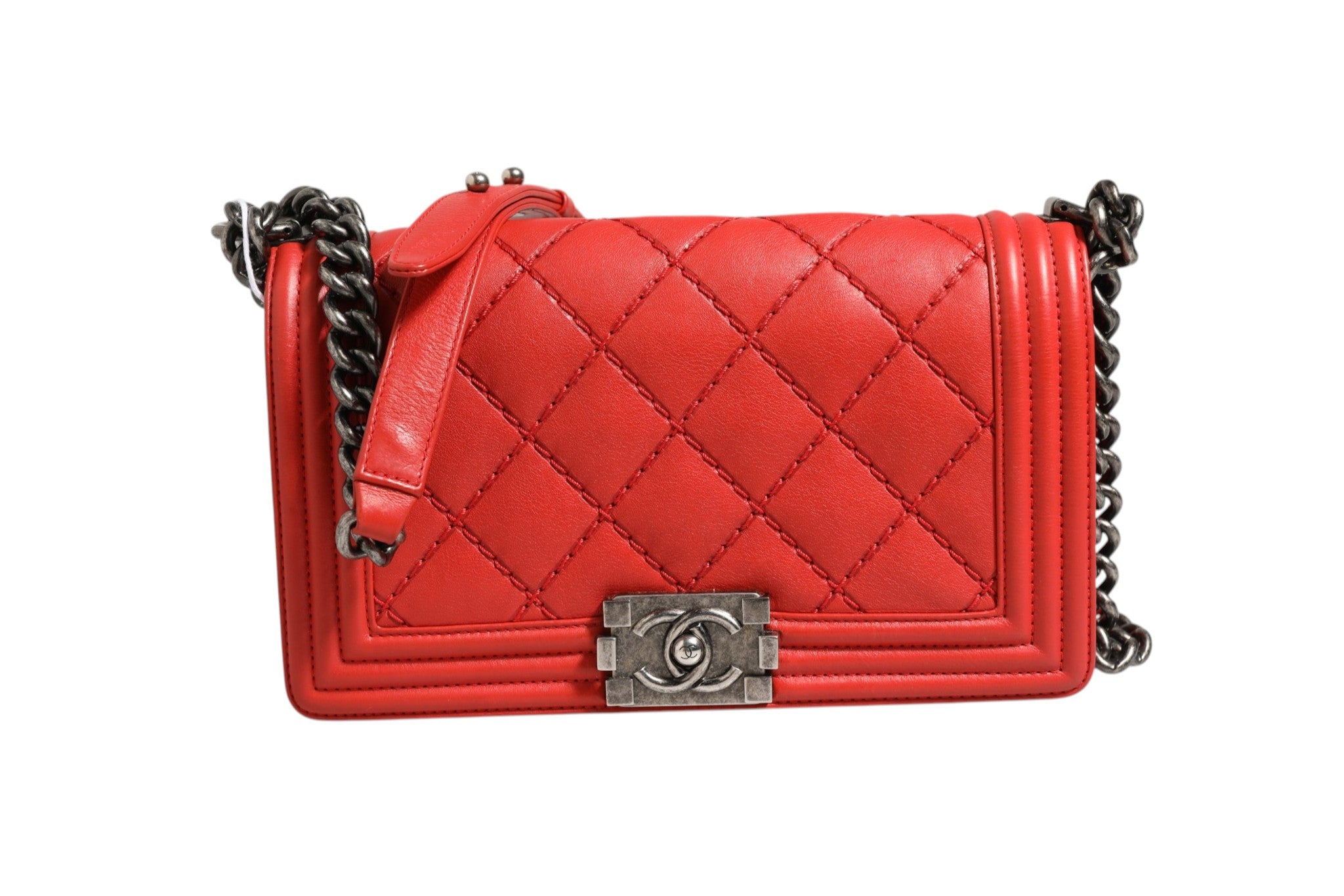 Discover the Chanel Red Diamond Stitch Calfskin Leather New Medium Boy Bag, a symbol of Parisian elegance and exquisite craftsmanship, perfect for elevating your style.