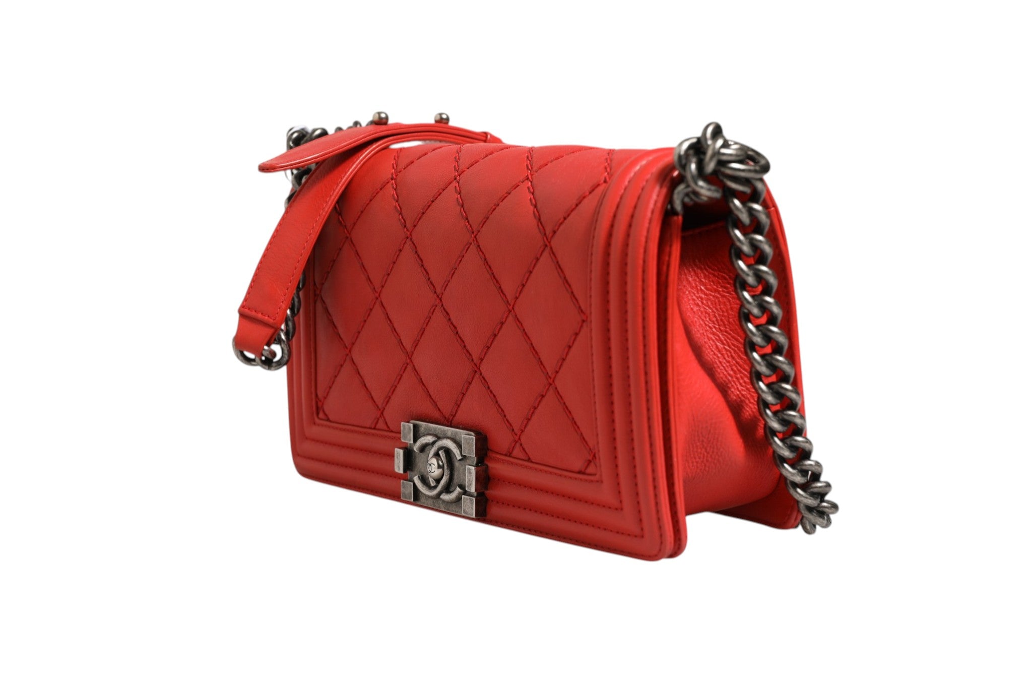 Discover the Chanel Red Diamond Stitch Calfskin Leather New Medium Boy Bag, a symbol of Parisian elegance and exquisite craftsmanship, perfect for elevating any ensemble.