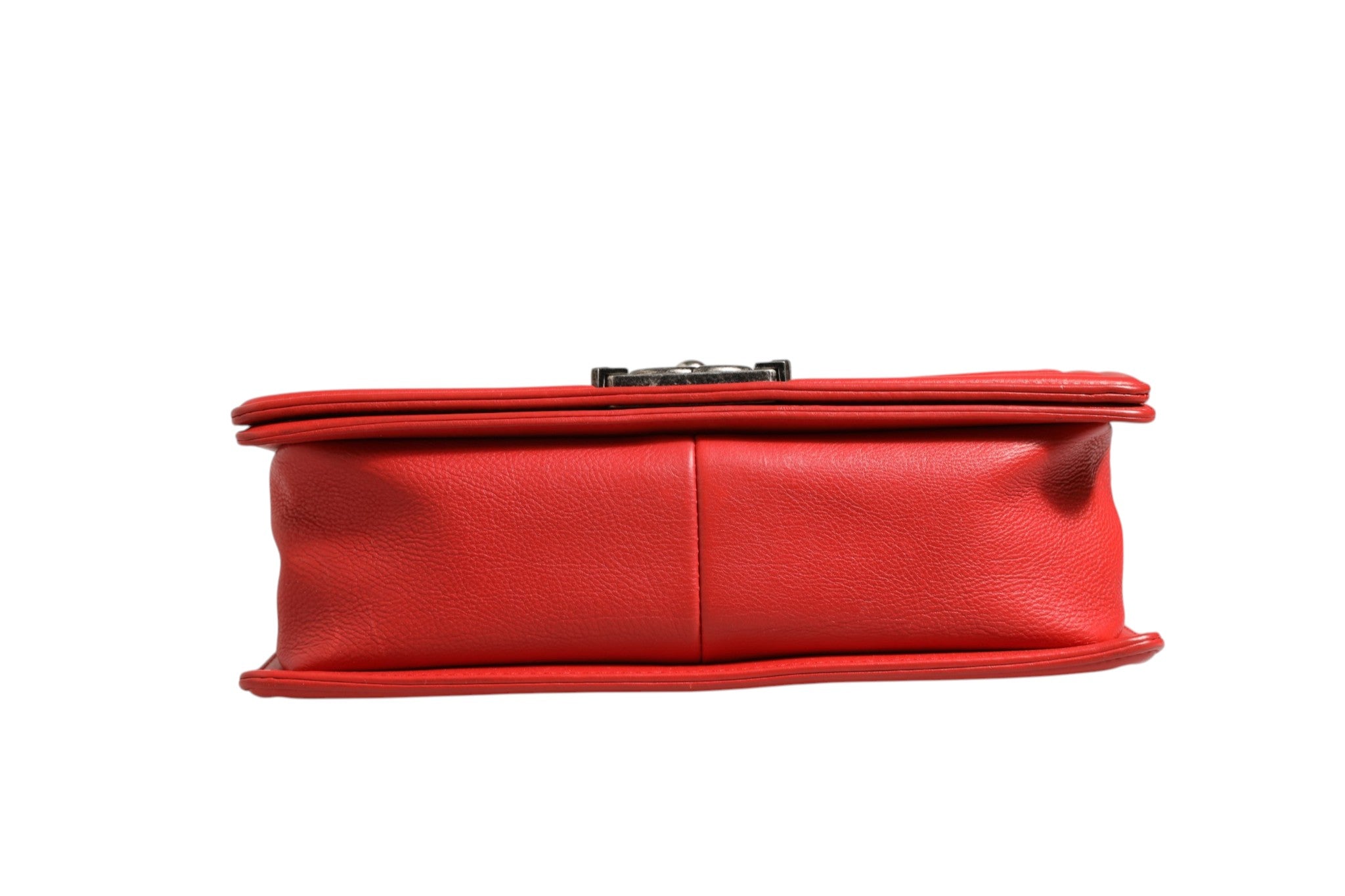 Discover the Chanel Red Diamond Stitch Calfskin Leather New Medium Boy Bag, a timeless symbol of luxury and elegance, crafted for those who command attention and sophistication.