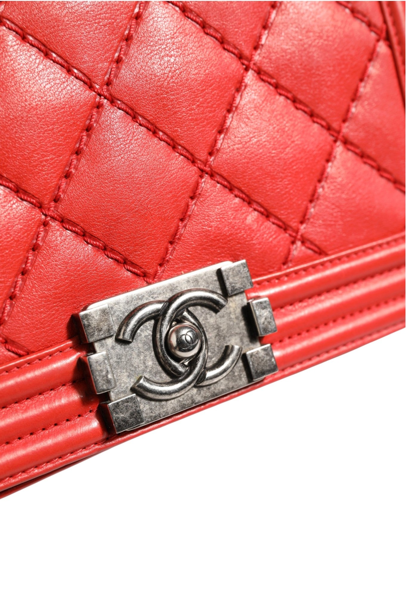 Discover the Chanel Red Diamond Stitch Calfskin Leather New Medium Boy Bag, a timeless symbol of elegance and exquisite craftsmanship, perfect for elevating any ensemble.