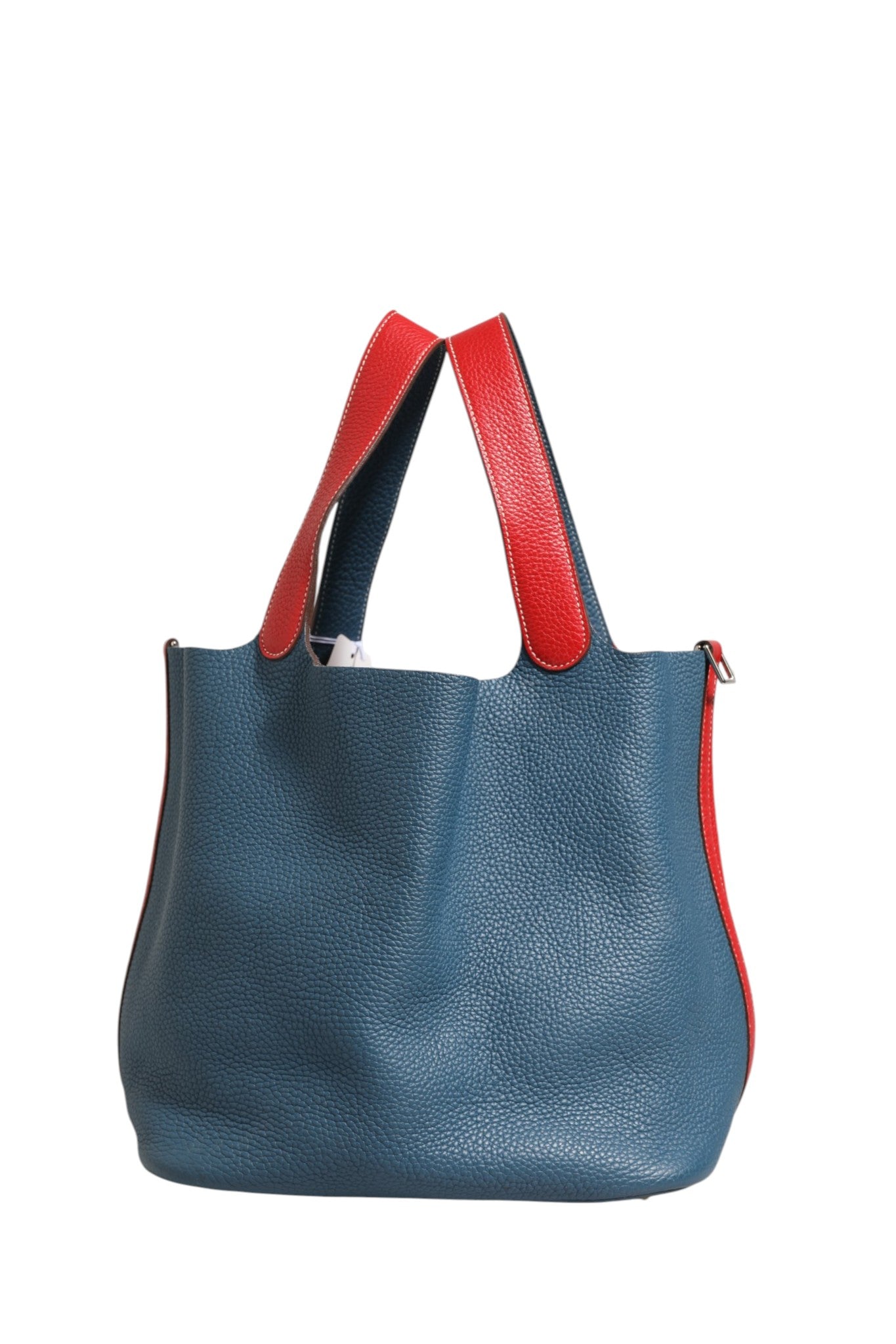 Discover the Hermès Picotin Lock 22 Bicolor Clemence, a luxurious blend of premium leather and exquisite craftsmanship, perfect for elevating any ensemble.