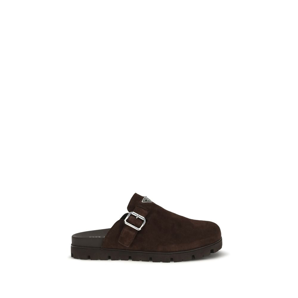 Indulge in the exquisite Prada Brown Calf Leather Bos Taurus Mules, where Italian craftsmanship meets minimalist elegance, perfect for the discerning connoisseur.