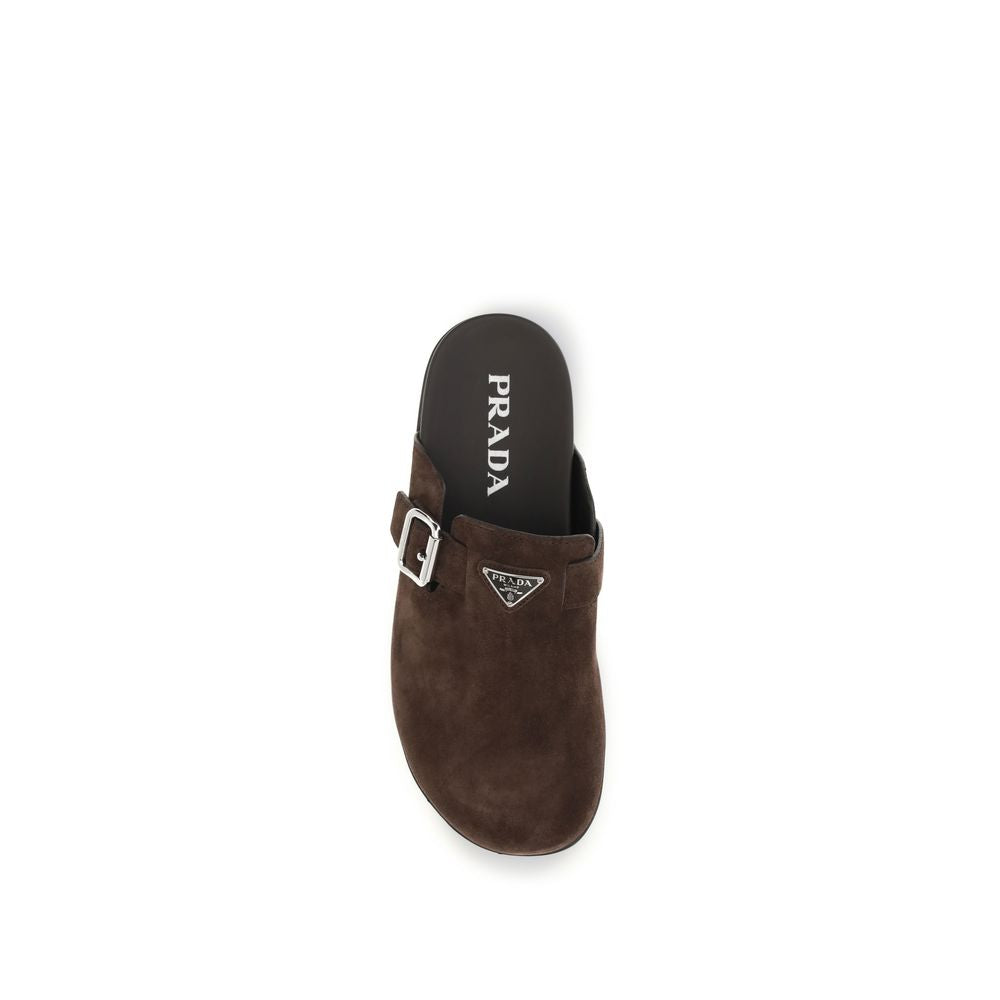 Experience the elegance of Prada Brown Calf Leather Bos Taurus Mules, crafted from sumptuous calf leather for refined sophistication and unparalleled comfort.