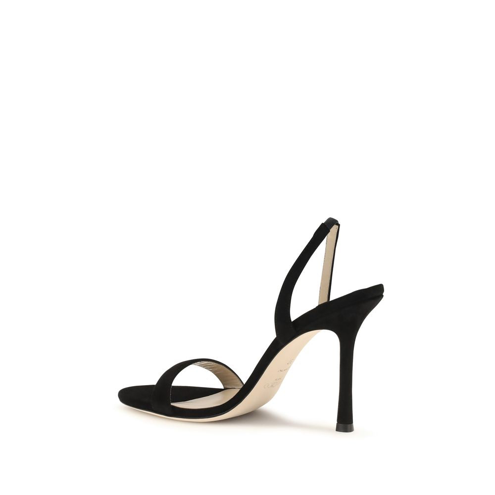 Experience the allure of Jimmy Choo's Black Calf Leather Bos Taurus Stiletto Heel Sandals, where exquisite craftsmanship meets timeless elegance for the discerning individual.