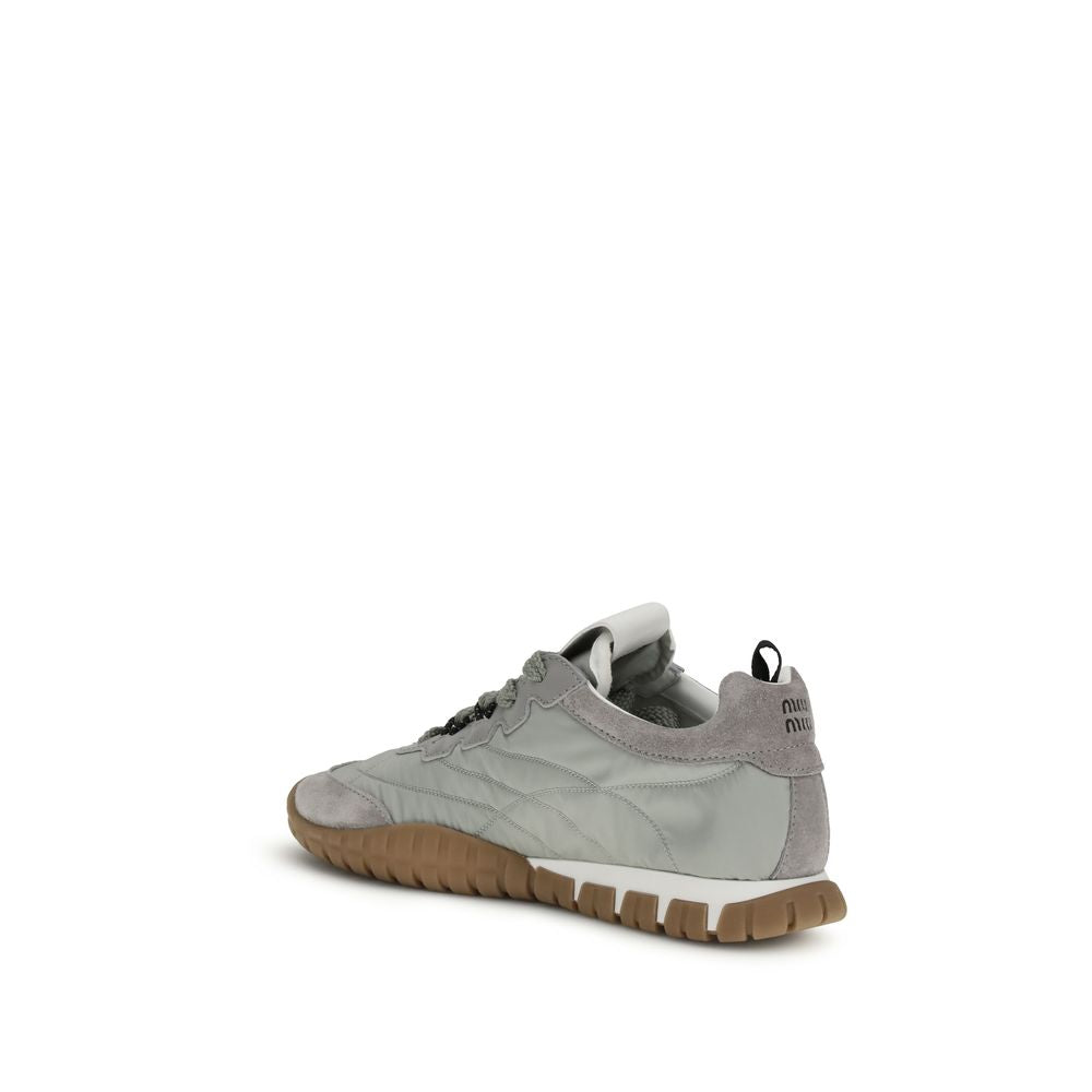 Elevate your style with Miu Miu's Gray Recycled Polyamide Athletic Sneakers, where sustainable luxury meets exquisite craftsmanship for the discerning fashion aficionado.