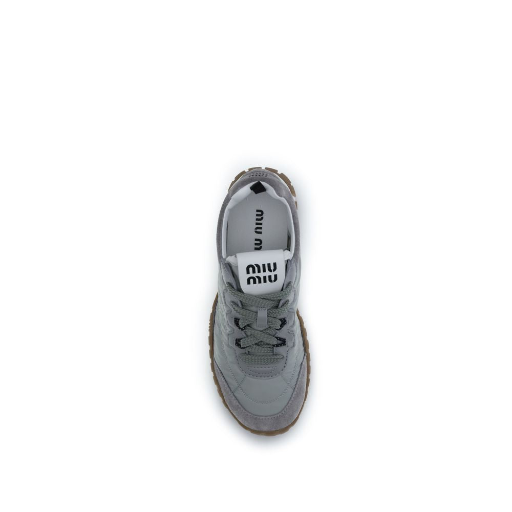 Discover Miu Miu's Gray Recycled Polyamide Athletic Sneakers, where sustainable luxury meets contemporary design, perfect for the discerning fashion connoisseur.