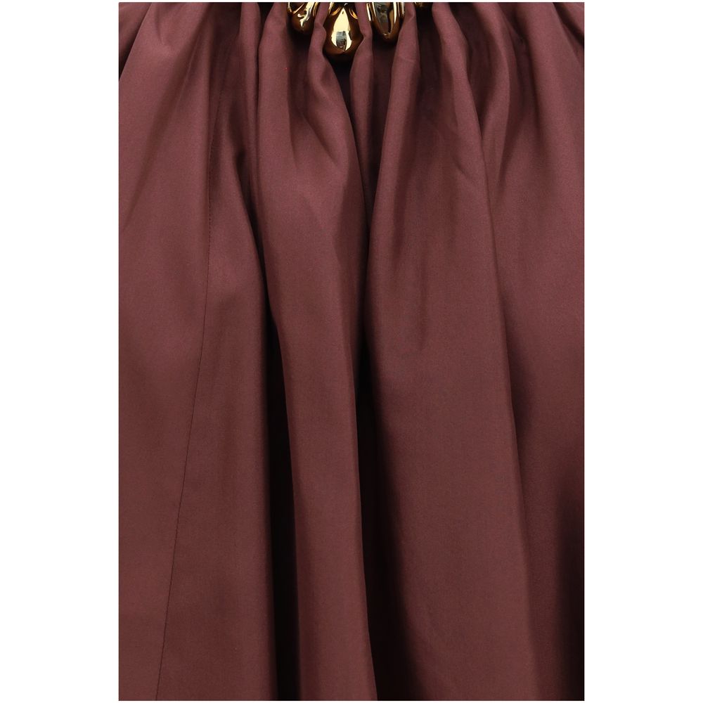 Indulge in the exquisite Zimmermann Bordeaux Silk Sleeveless T-Shirt, a masterpiece of silk habotai, featuring elegant ruching and beaded detailing for timeless allure.
