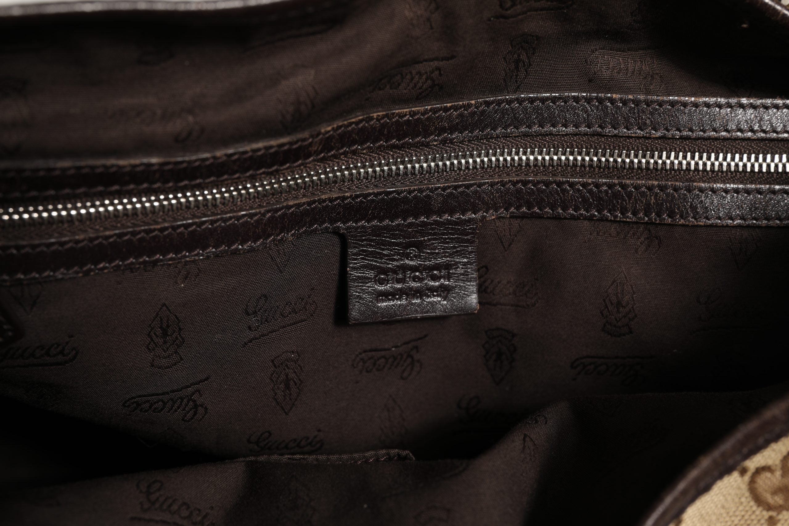 Elevate your style with the Gucci Beige and Black Canvas Twins Medium Tote Bag, a masterpiece of canvas and leather that embodies timeless luxury and sophistication.