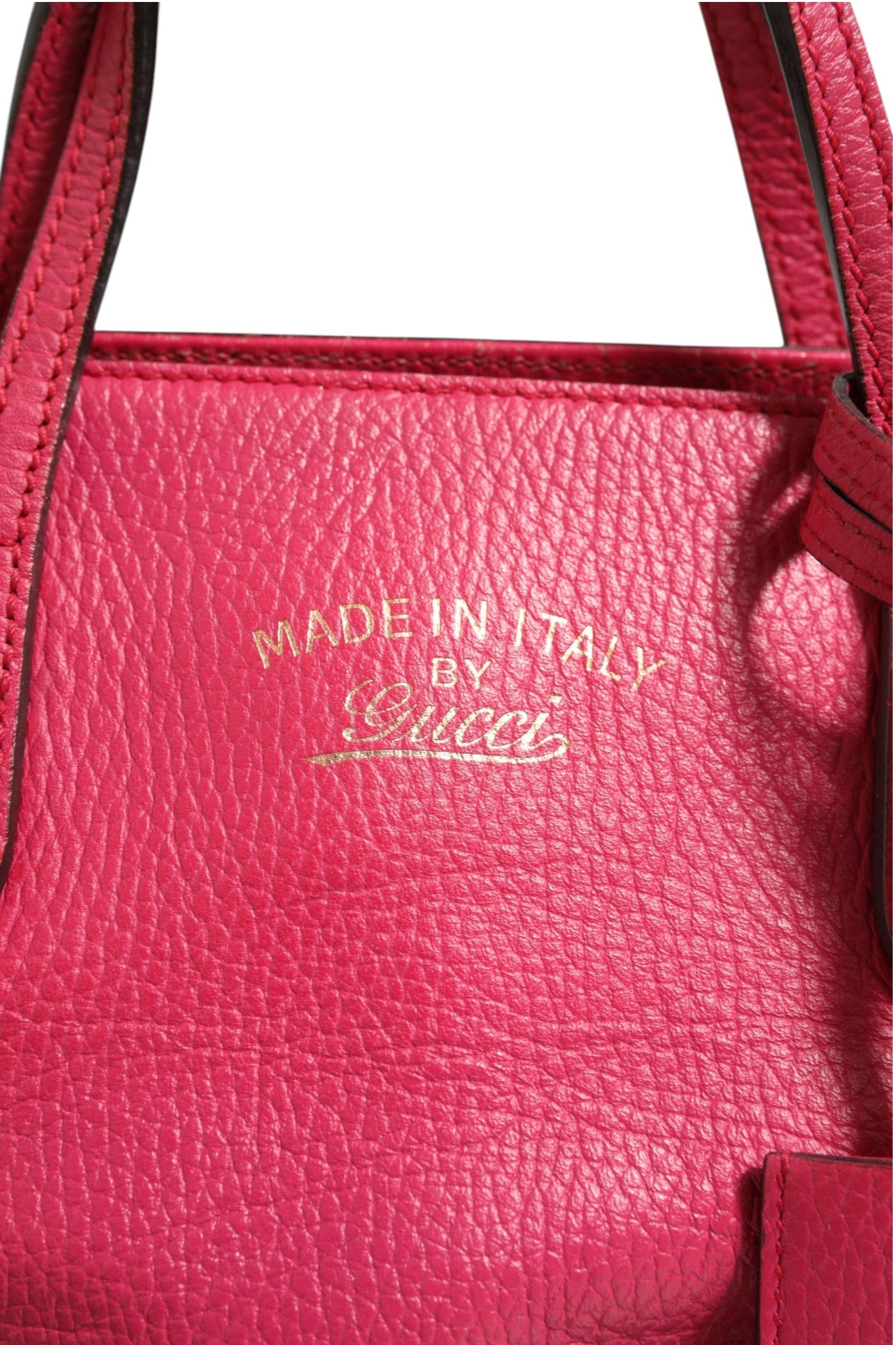 Elevate your style with the Gucci Swing Leather 2Way Tote Bag, a luxurious fuchsia pink accessory that embodies sophistication and timeless elegance for the discerning individual.