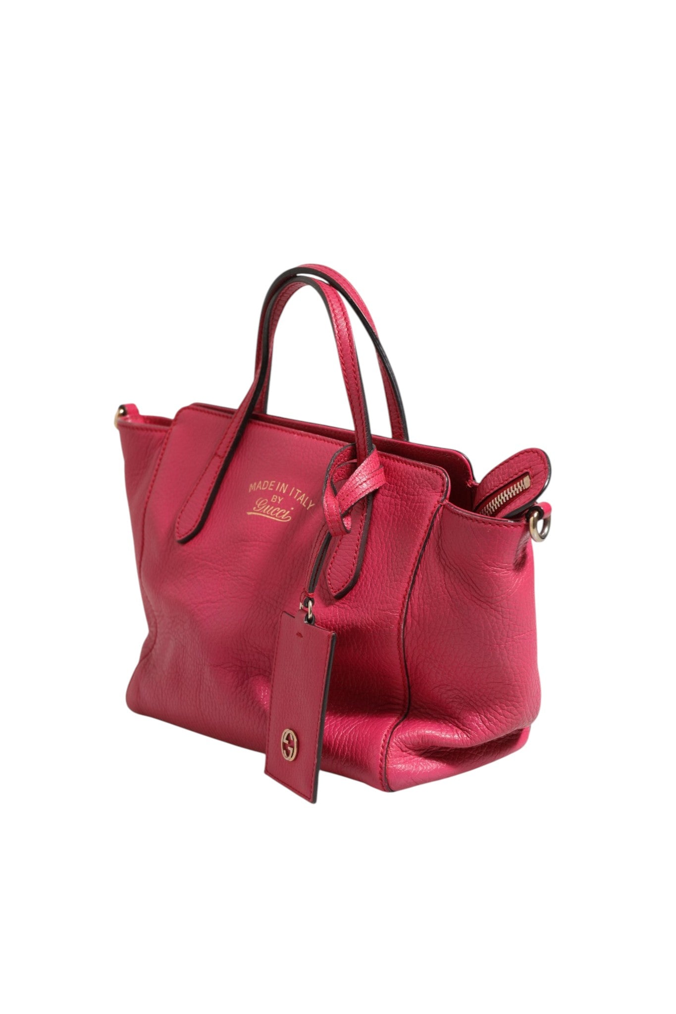 Elevate your style with the Gucci Swing Leather 2Way Tote Bag, a luxurious fuchsia pink accessory that embodies sophistication and versatility for the discerning individual.
