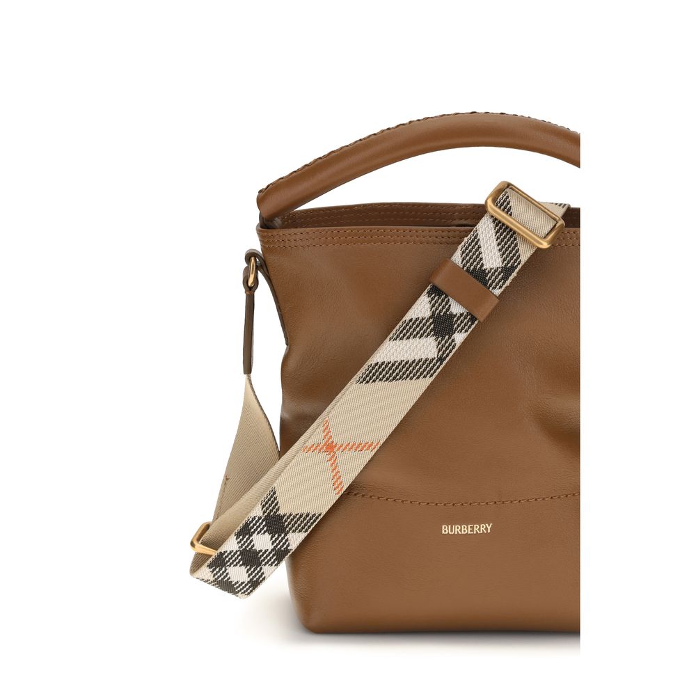 Discover the Burberry Brown Calf Leather Bos Taurus Bucket Bag, a masterpiece of craftsmanship that embodies timeless luxury and contemporary elegance for the discerning individual.