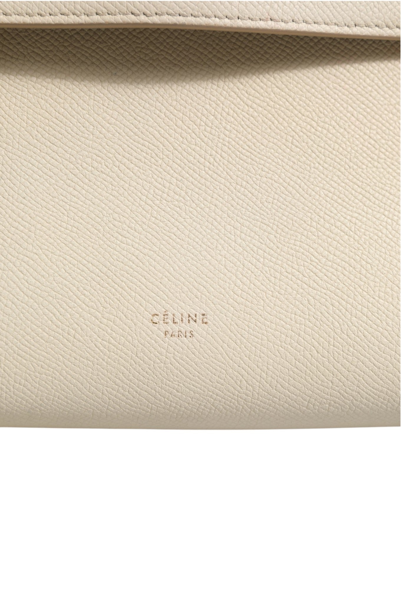 Indulge in the Celine Nano Belt Bag, a masterpiece of grained calfskin in Off White, embodying timeless elegance and unparalleled craftsmanship for the discerning individual.