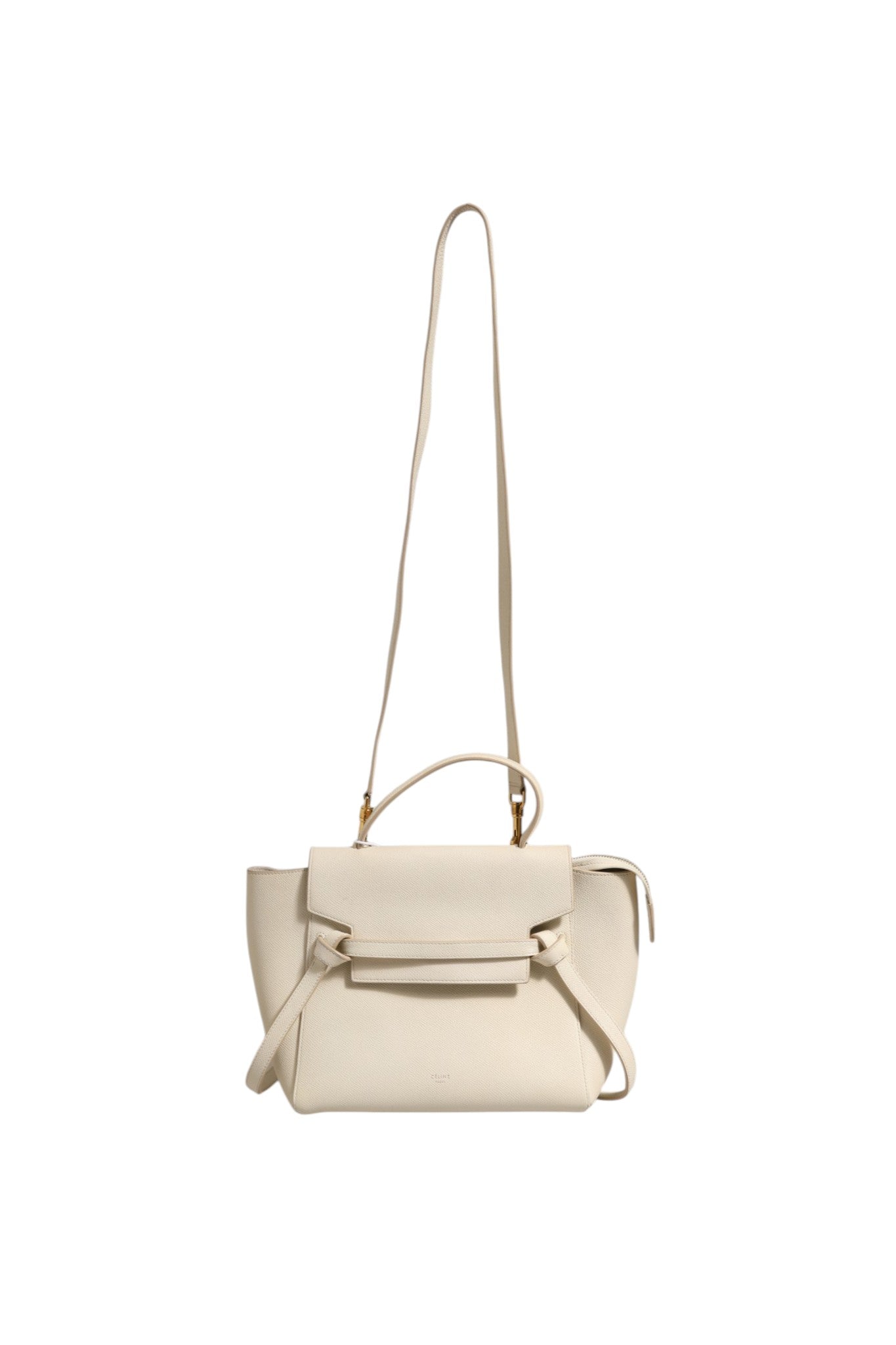 Indulge in the exquisite Celine Nano Belt Bag, crafted from luxurious grained calfskin in Off White, a timeless statement of elegance and sophistication for the discerning individual.