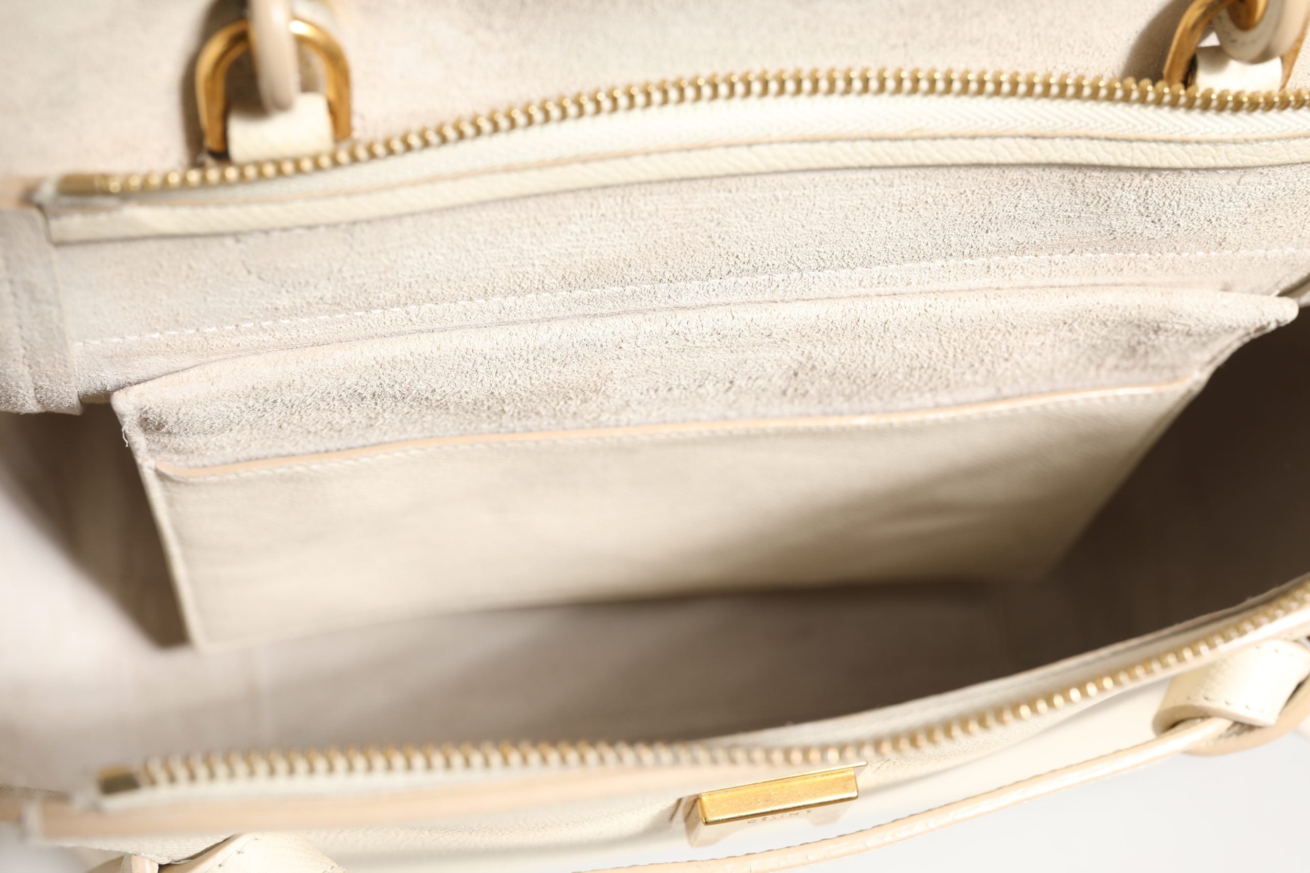Elevate your style with the Celine Nano Belt Bag in Off White grained calfskin, a timeless piece that embodies luxury and sophistication for the discerning individual.