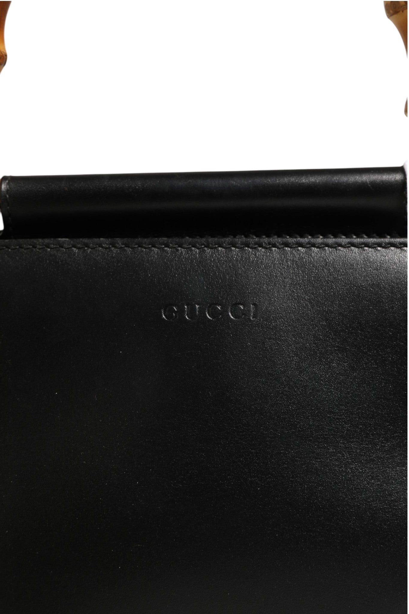 Discover the Gucci Nymphaea Bamboo Top Handle Leather Bag, a symbol of timeless elegance and exquisite craftsmanship, perfect for the discerning connoisseur.