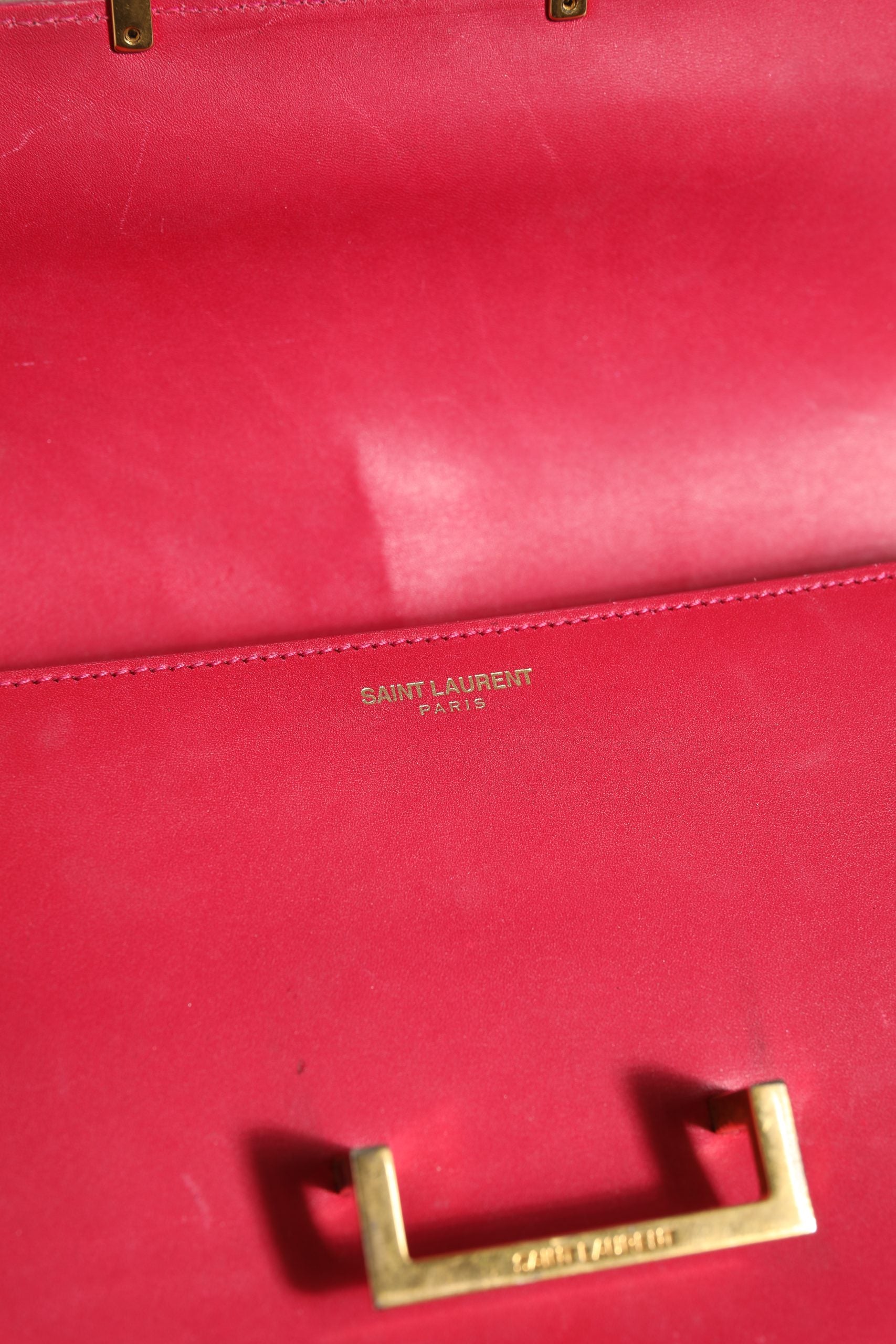 Elevate your style with the Saint Laurent Loulou Handbag, a timeless pink masterpiece that embodies luxury and sophistication for the discerning individual.