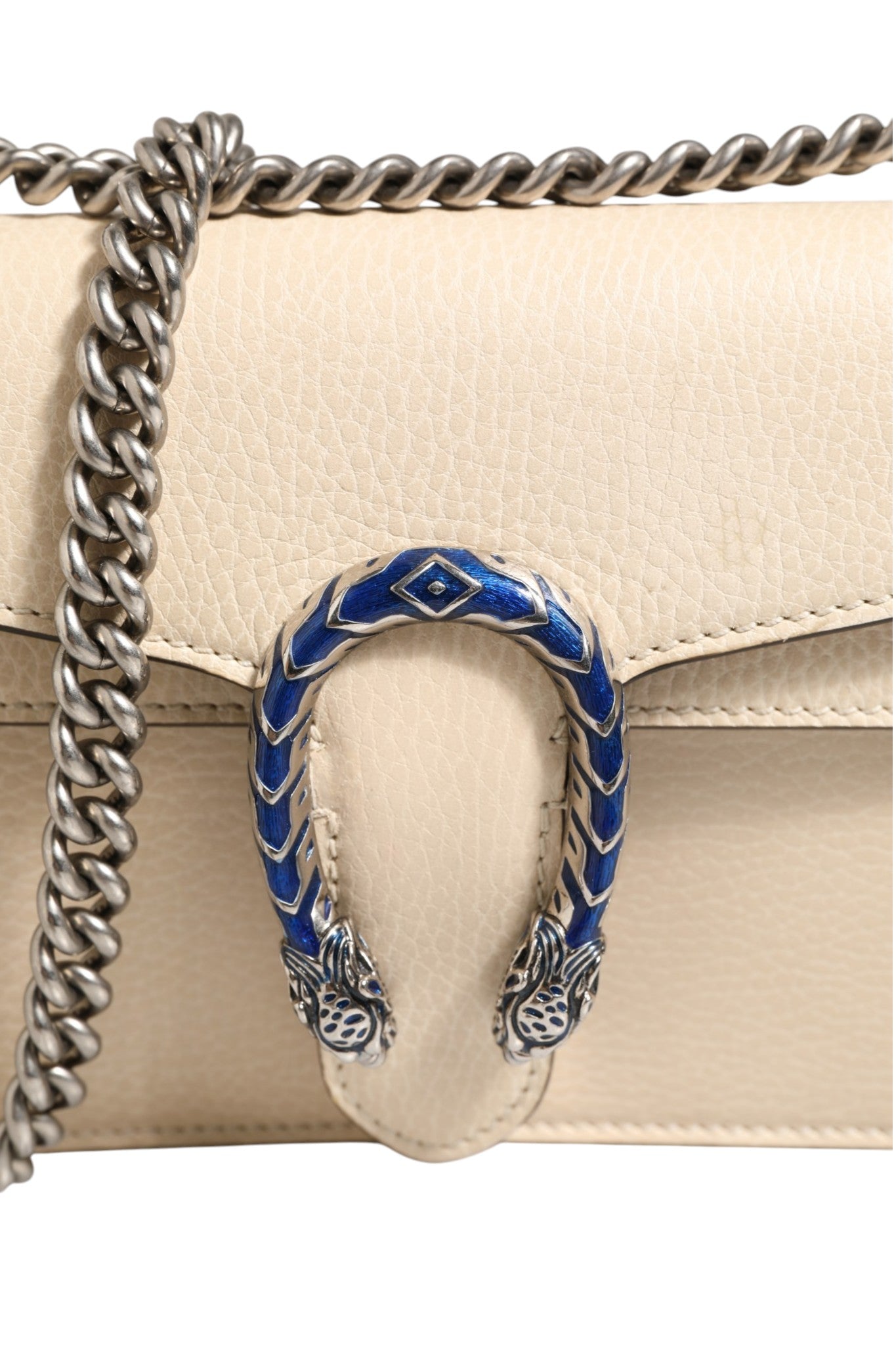 Indulge in the exquisite Gucci Dionysus White Leather Handbag, a timeless masterpiece of luxury craftsmanship that elevates your style and embodies sophistication.
