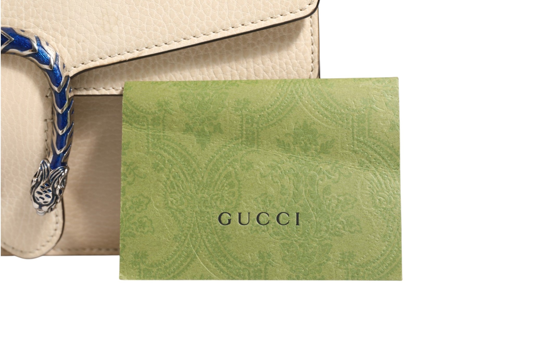 Discover the Gucci Dionysus White Leather Handbag, a timeless symbol of elegance and sophistication, crafted for those who embody luxury and style.