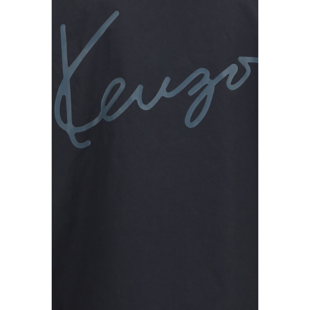 Experience the exquisite Kenzo Black Cotton Jacket, a masterful blend of cotton and nylon, embodying effortless elegance and sophisticated versatility for the discerning individual.