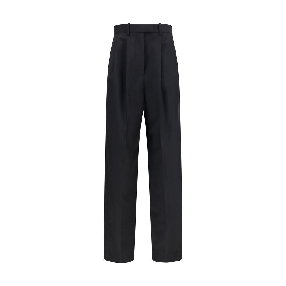 Discover the Givenchy Black Wool Oves Aries Dress Pants, a blend of luxurious wool and mohair, embodying refined craftsmanship for the discerning individual.