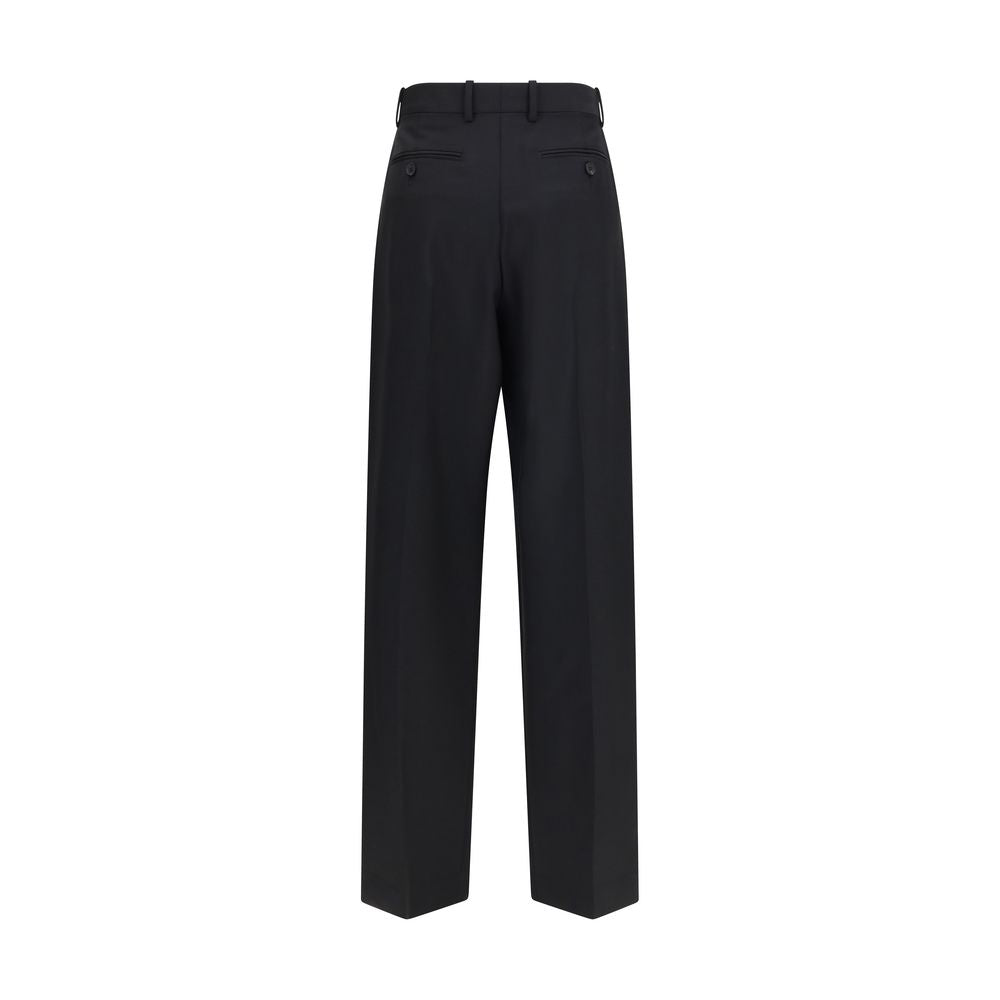Elevate your wardrobe with Givenchy Black Wool Oves Aries Dress Pants, a luxurious blend of 73% Wool Ovis Aries and 27% Mohair, embodying modern haute couture elegance.