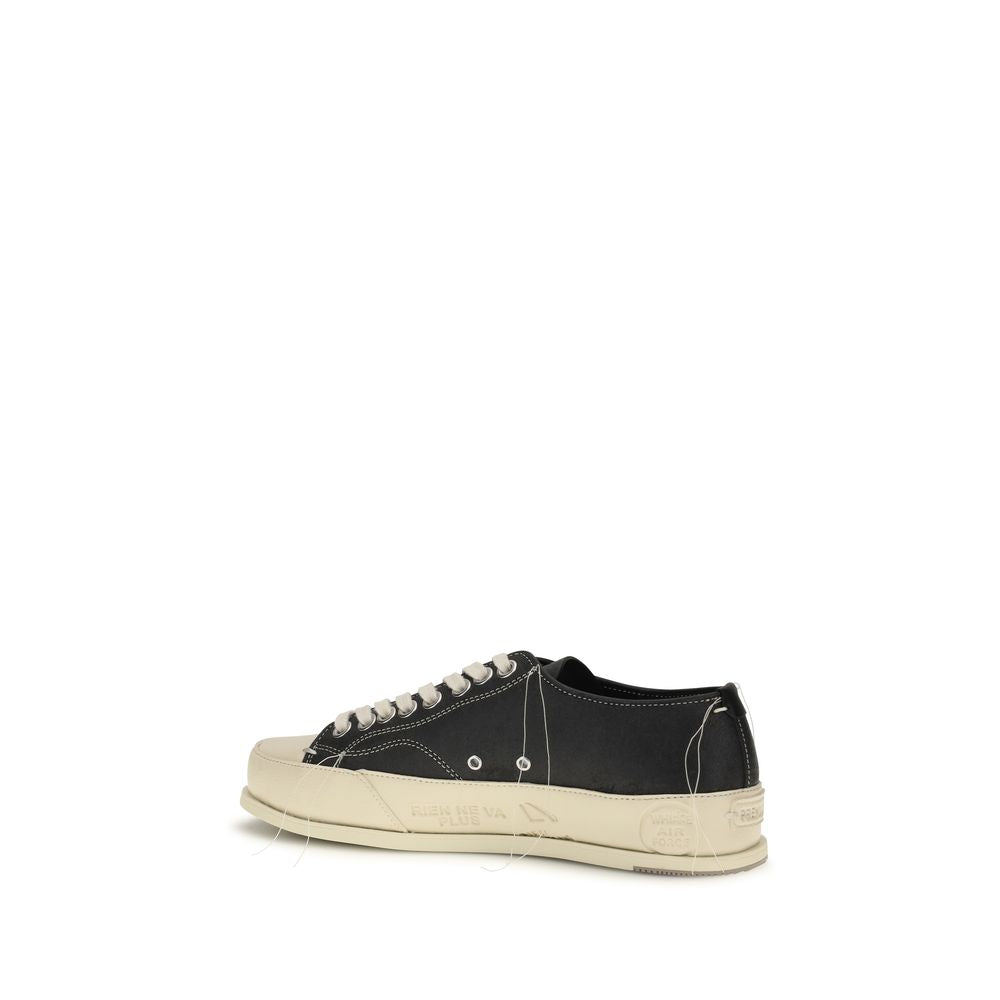 Experience the exquisite craftsmanship of Premiata Black Calf Leather Bos Taurus Low Top Sneakers, where luxury meets modern elegance for the discerning individual.