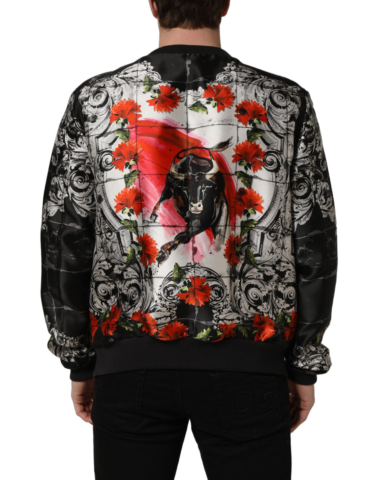 Elevate your style with the Dolce & Gabbana Multicolor Majolica Bull Print Bomber Jacket, a silk masterpiece that embodies Italian craftsmanship and luxurious flair.