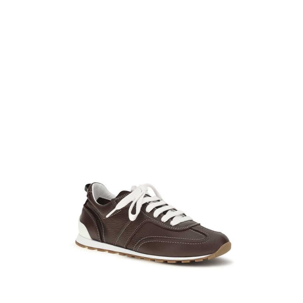 Elevate your style with Brunello Cucinelli's Brown Calf Leather Bos Taurus Athletic Sneakers, where artisanal craftsmanship meets luxurious comfort for the discerning individual.