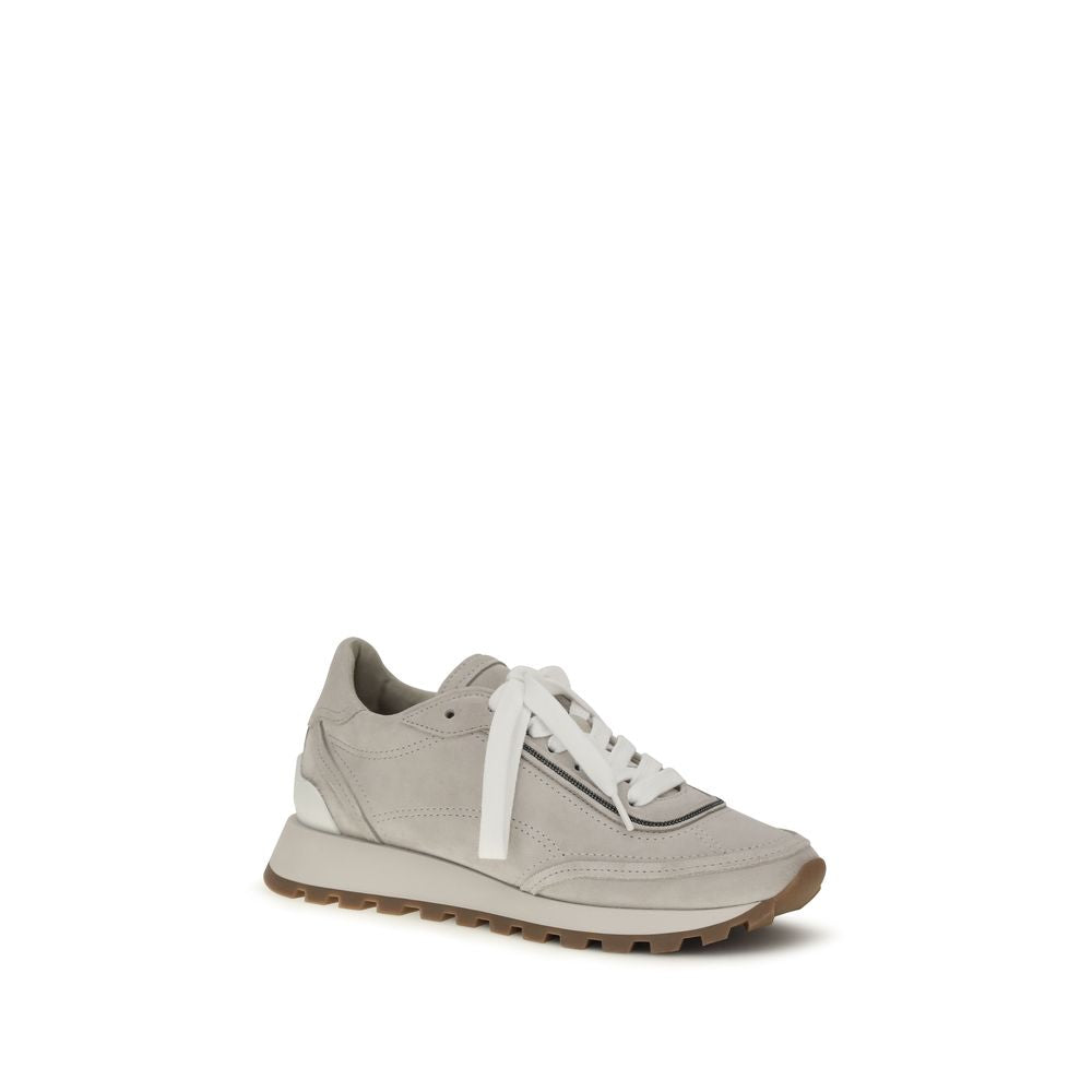 Indulge in the exquisite Brunello Cucinelli Gray Calf Leather Bos Taurus Sneakers, where artisanal craftsmanship meets contemporary elegance, redefining luxury footwear.