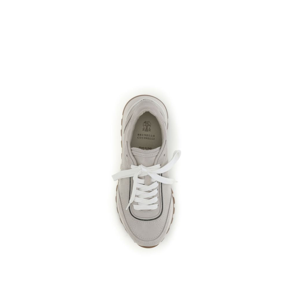 Indulge in the exquisite Brunello Cucinelli Gray Calf Leather Bos Taurus Athletic Sneakers, where artisanal craftsmanship meets contemporary elegance, redefining luxury footwear.