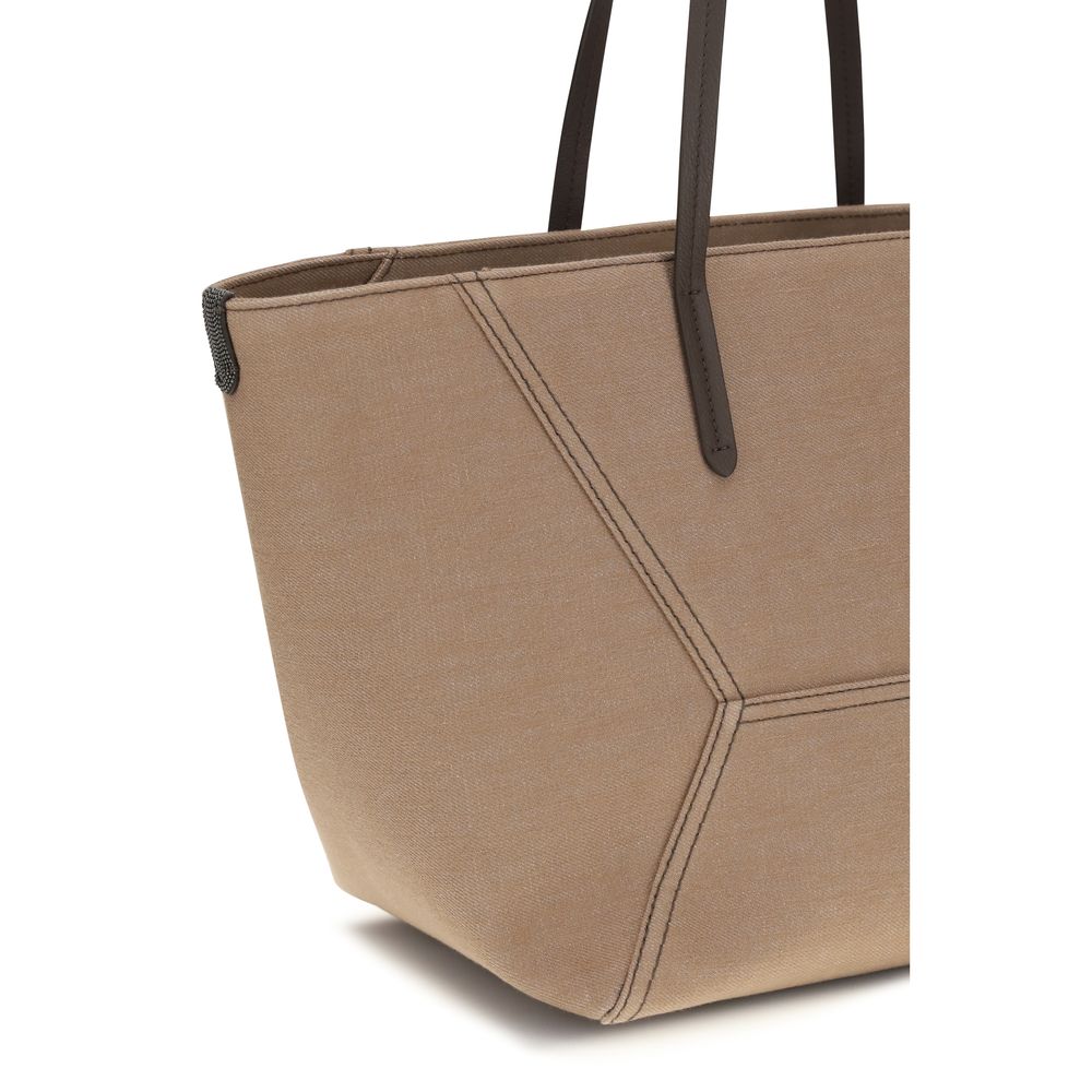 Indulge in the exquisite Brunello Cucinelli Beige Cotton Handbag from the SS26 collection, a testament to luxurious craftsmanship and timeless elegance.