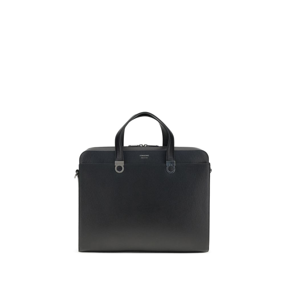 Experience the epitome of sophistication with the Ferragamo Black Calf Leather Bos Taurus Briefcase, a masterful blend of luxury and functionality for the discerning individual.