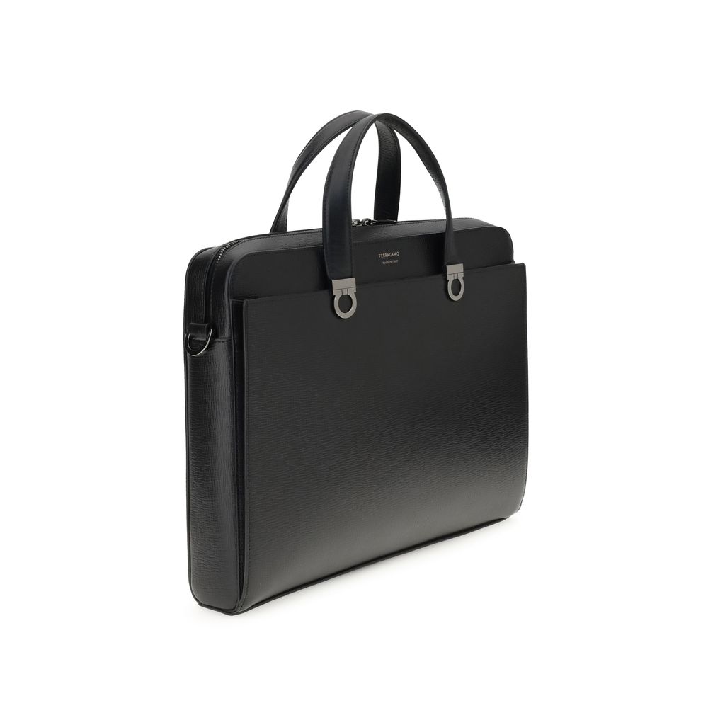 Experience the epitome of sophistication with the Ferragamo Black Calf Leather Bos Taurus Briefcase, a masterclass in luxury craftsmanship and timeless elegance.
