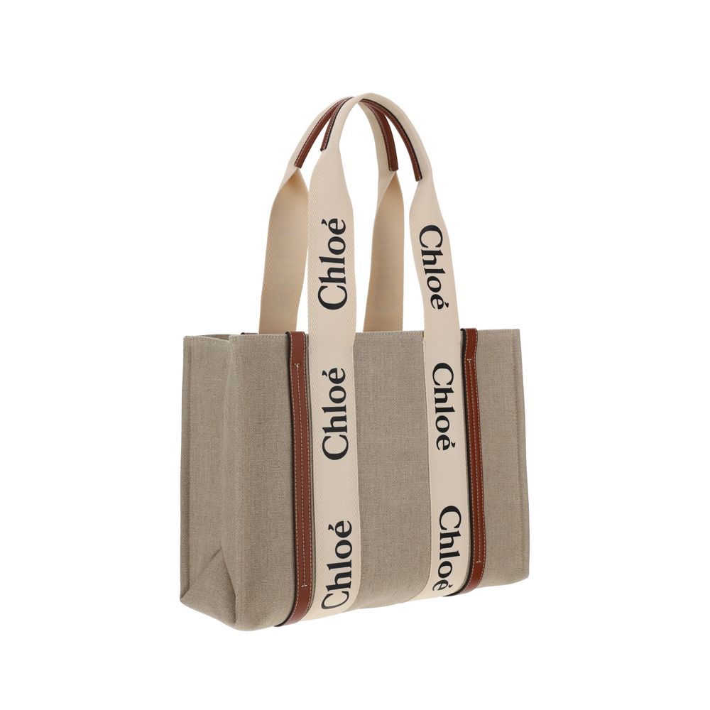 Indulge in the Chloé Beige Linen Handbag, a masterpiece of artisanal craftsmanship and sustainable luxury, perfect for the discerning individual seeking timeless elegance.