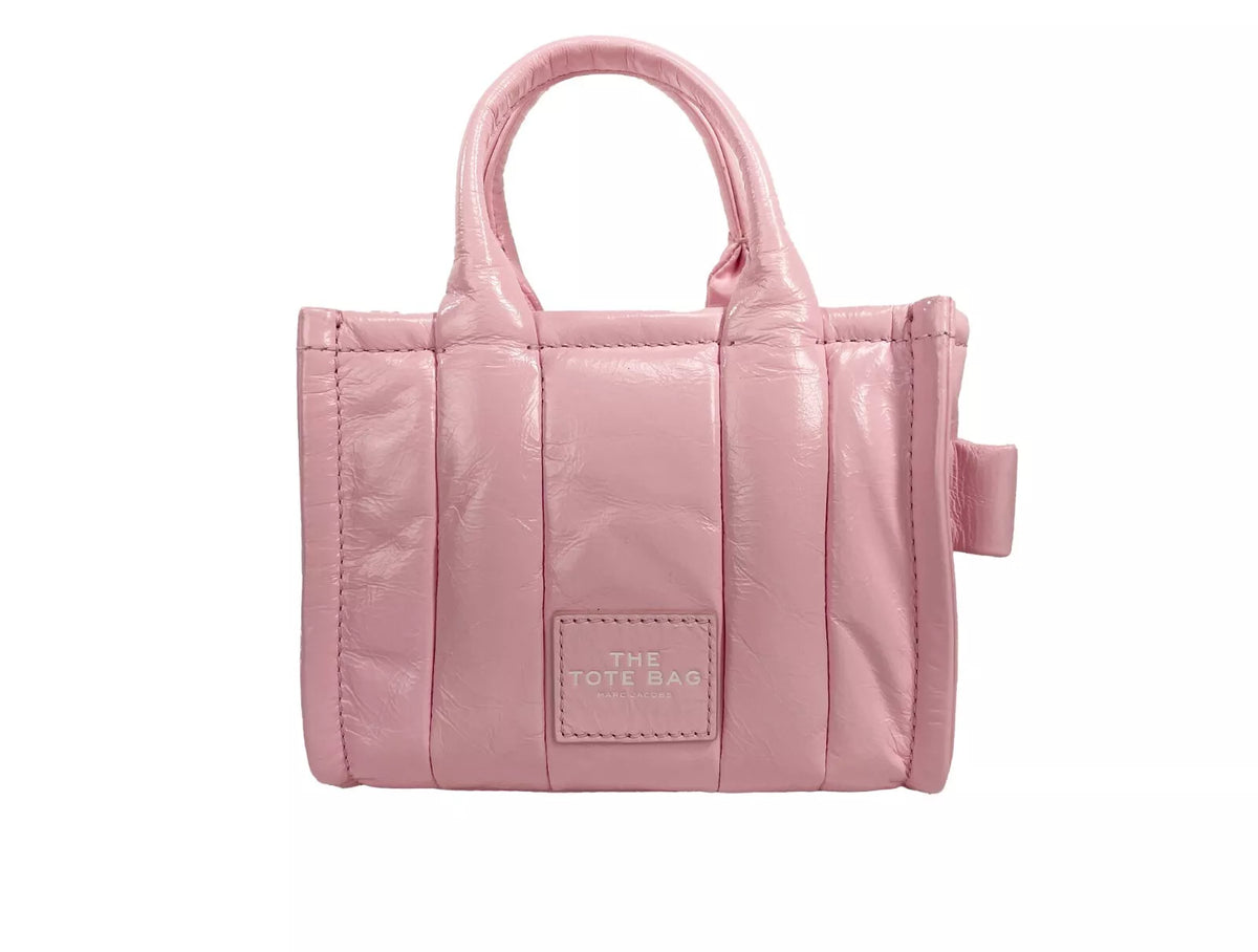 Elevate your style with the Marc Jacobs The Shiny Crinkle Micro Tote, a luxurious patent leather masterpiece that embodies contemporary sophistication and playful elegance.