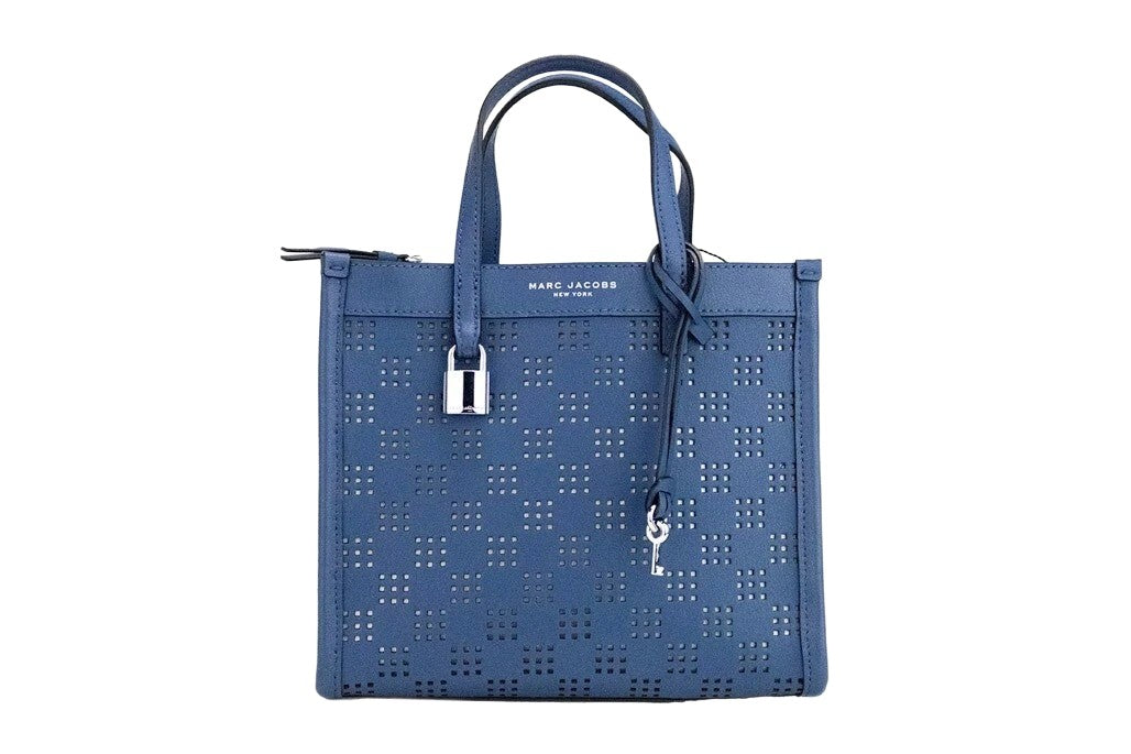 Indulge in the elegance of the Marc Jacobs Mini Grind Blue Sea Perforated Leather Crossbody Tote Bag, a masterpiece of exceptional craftsmanship and timeless style.