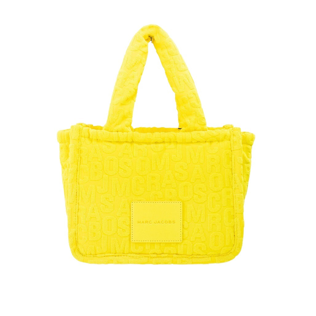 Elevate your style with Marc Jacobs The Monogram Terry Tote in vibrant golden kiwi, a luxurious blend of contemporary design and exquisite craftsmanship for the discerning individual.