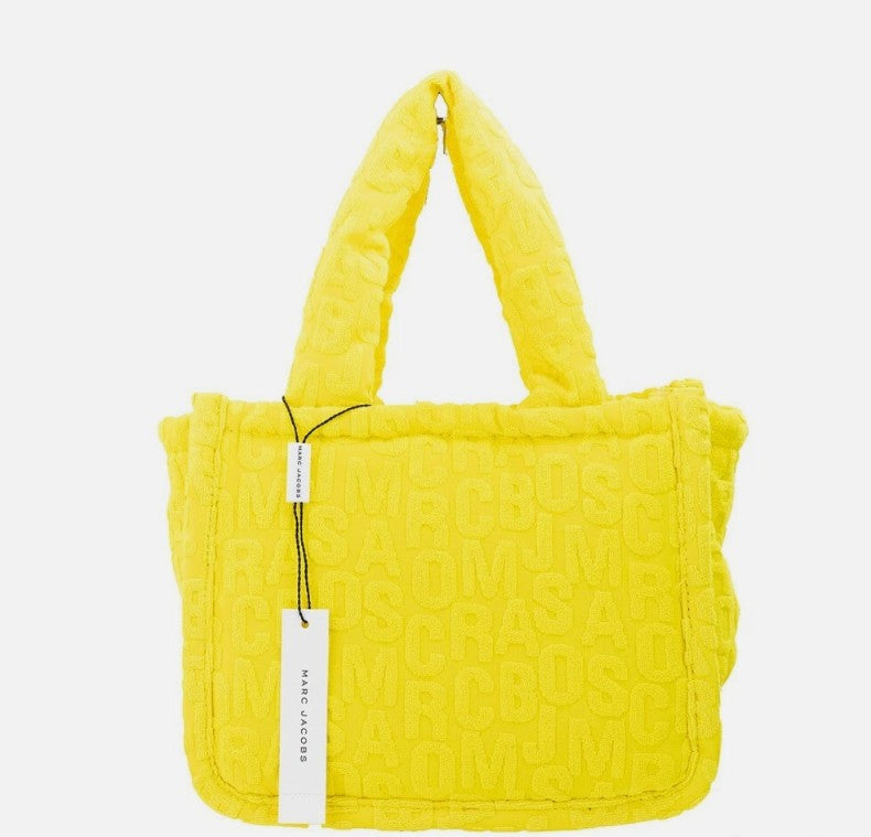 Elevate your style with the Marc Jacobs The Monogram Terry Tote in vibrant golden kiwi, a luxurious blend of contemporary design and exquisite craftsmanship for the modern connoisseur.