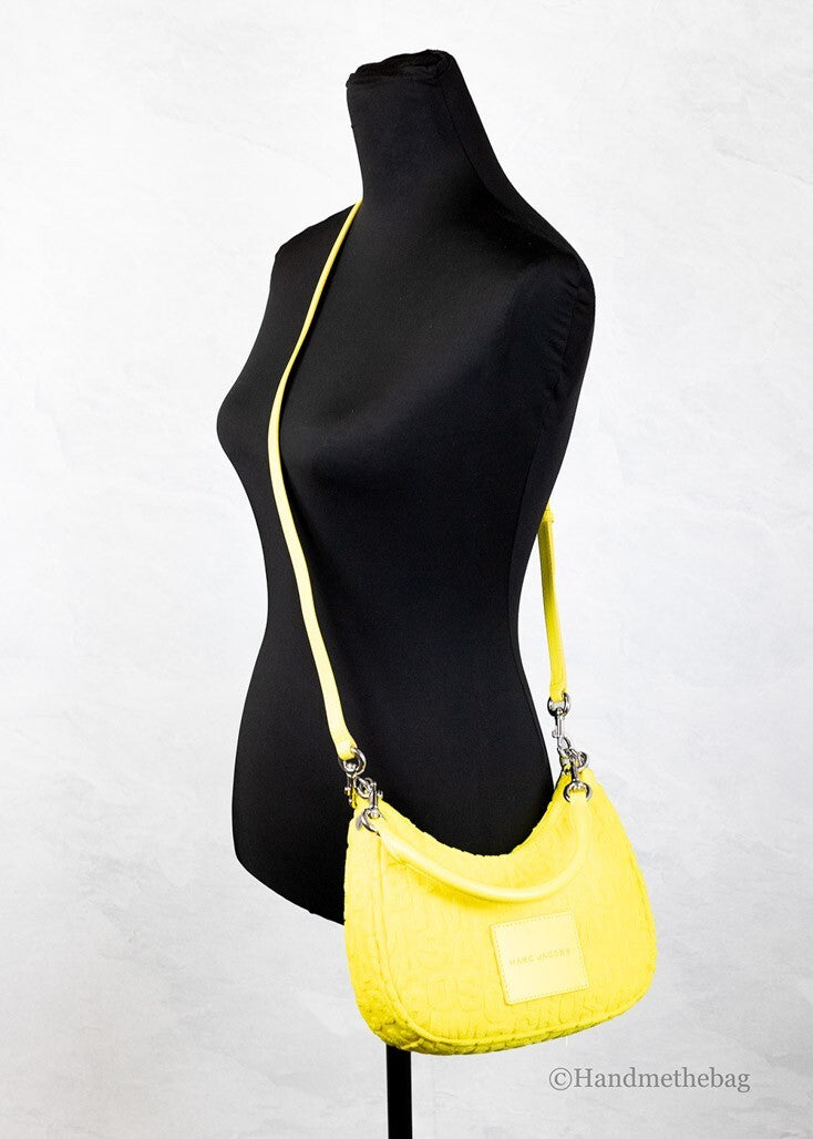 Indulge in the elegance of the Marc Jacobs Monogram Terry Fabric Golden Kiwi Hobo Shoulder Bag, where luxurious craftsmanship meets vibrant style for the discerning individual.