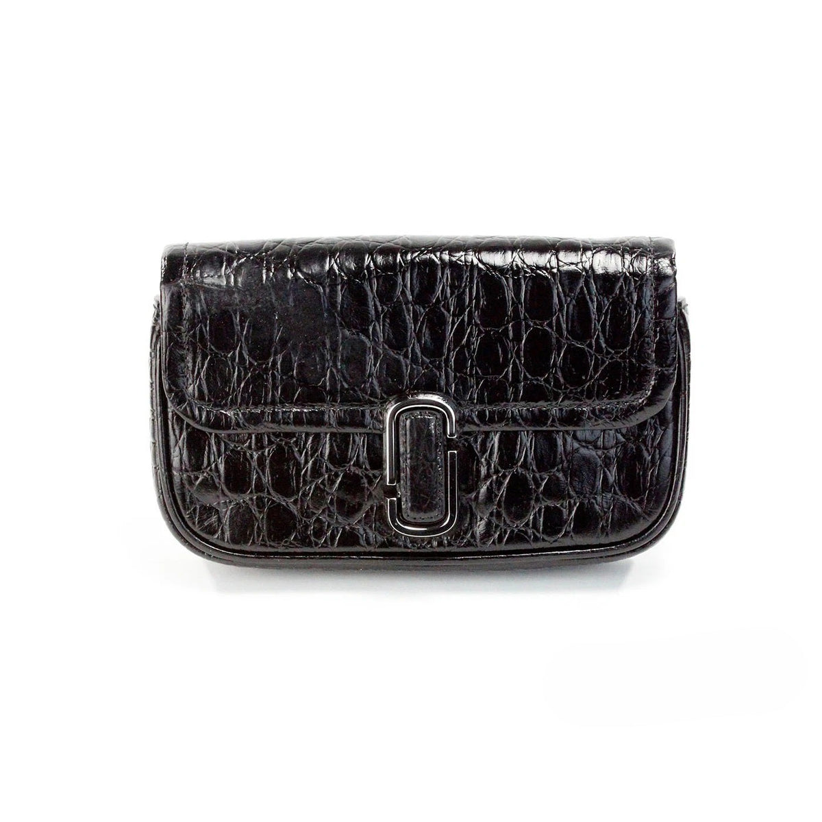 Indulge in the elegance of Marc Jacobs The Mini Shoulder Bag, a masterpiece of embossed leather that redefines luxury and sophistication for the modern connoisseur.
