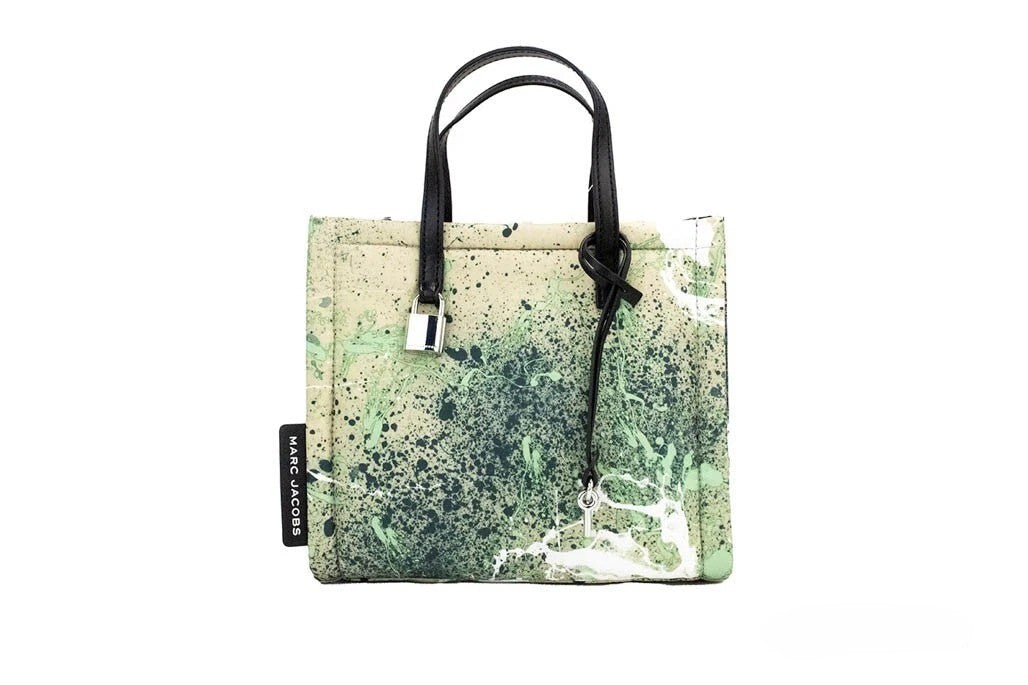 Elevate your style with the Marc Jacobs Mini Green Multi Splatter Paint Print Nylon Crossbody Tote, a harmonious blend of vibrant artistry and exquisite craftsmanship, perfect for any occasion.