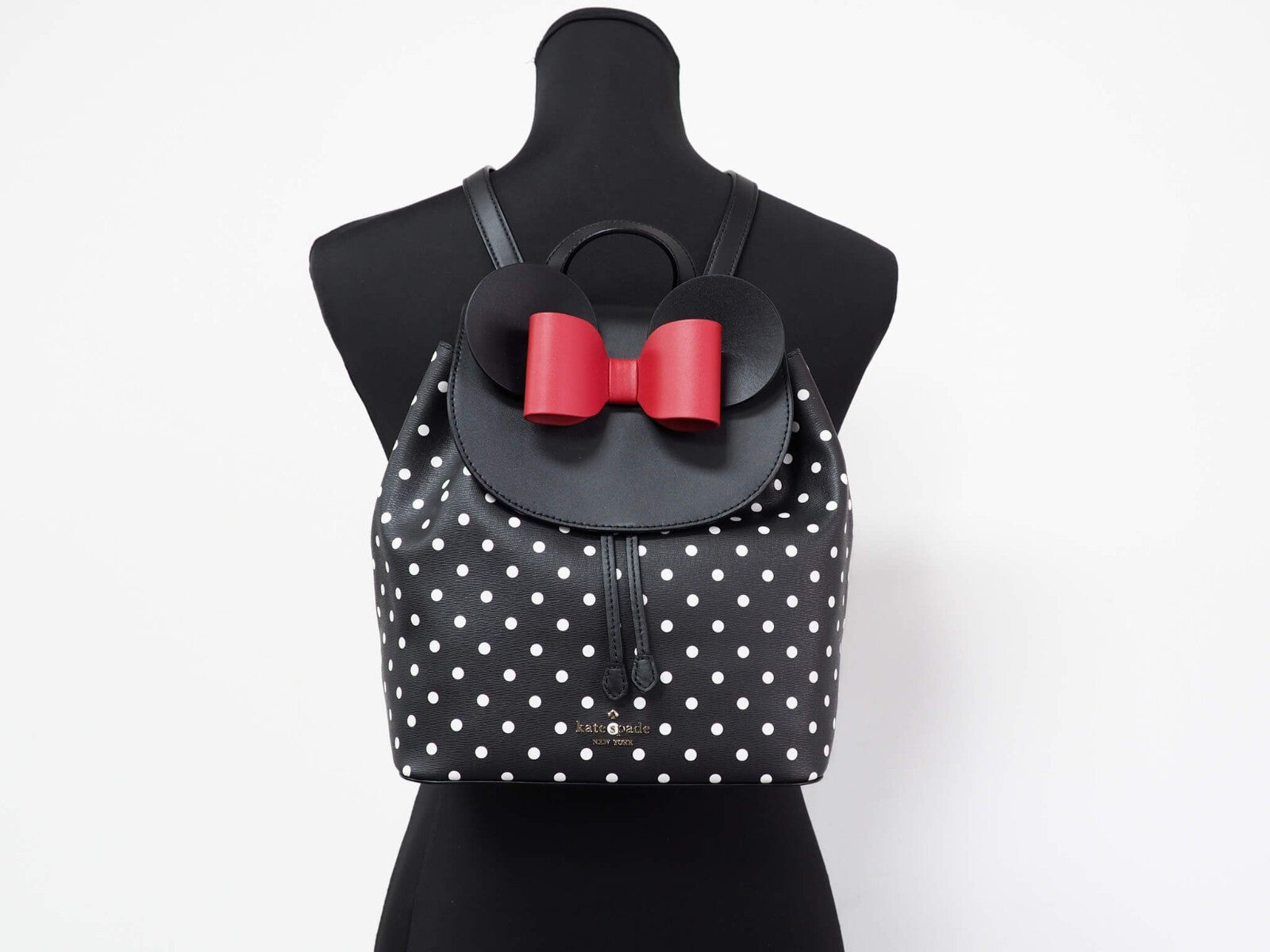 Indulge in the exquisite craftsmanship of the Kate Spade Disney Minnie Mouse Medium Leather Backpack, a luxurious blend of whimsy and sophistication for the discerning individual.