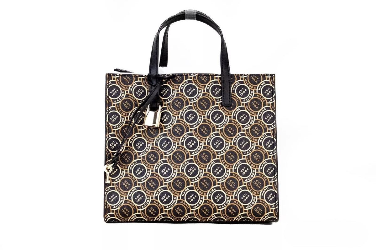 Discover the Marc Jacobs Mini Grind Signet Printed Leather Crossbody Tote, a 2023 masterpiece in luxurious pebbled leather, blending artistry with timeless elegance for the discerning individual.