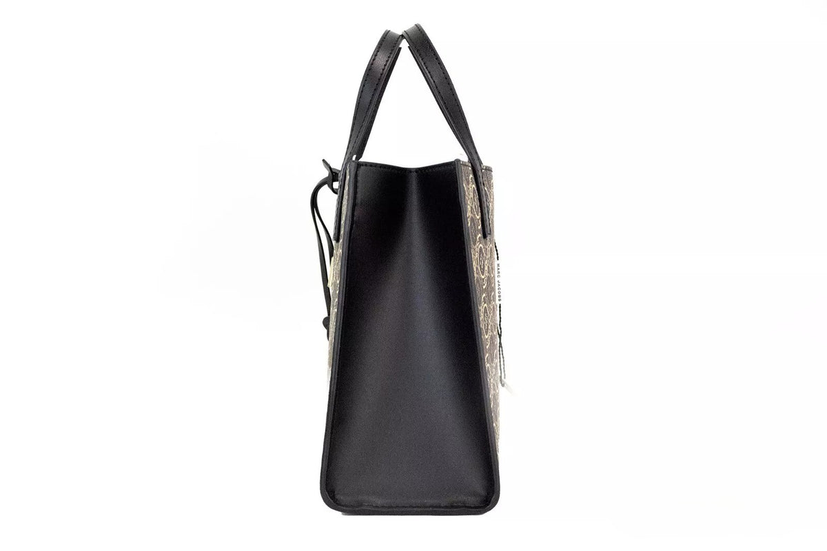 Discover the Marc Jacobs Mini Grind Signet Printed Leather Crossbody Tote, a masterpiece of 2023 craftsmanship in luxurious pebbled leather, perfect for elevating any ensemble.