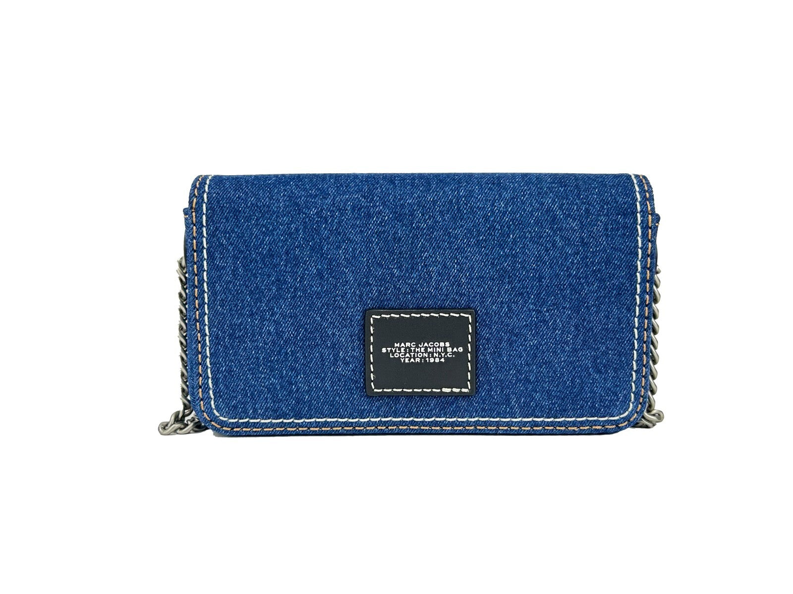 Discover the Marc Jacobs The Denim Chain Mini Bag, a masterpiece in high-quality denim, merging sophistication and practicality for the discerning individual.