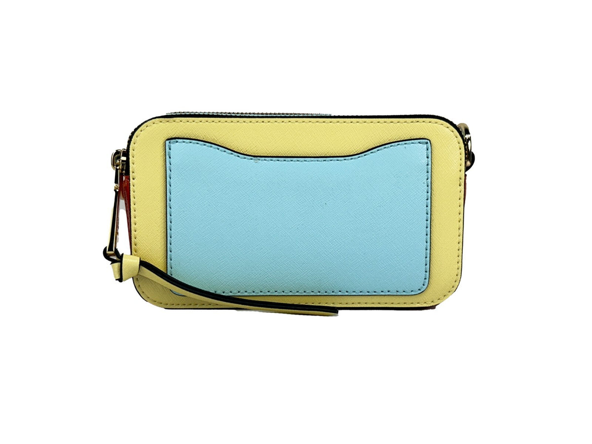 Indulge in the exquisite allure of the Marc Jacobs The Snapshot Crossbody Bag, crafted from high-quality leather, blending playful elegance with timeless sophistication for every occasion.