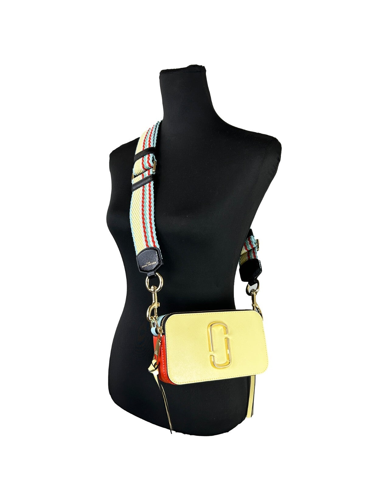 Discover the Marc Jacobs The Snapshot Crossbody Bag in Pastel Yellow Multi, a masterful blend of high-quality leather and exquisite craftsmanship, perfect for any sophisticated occasion.