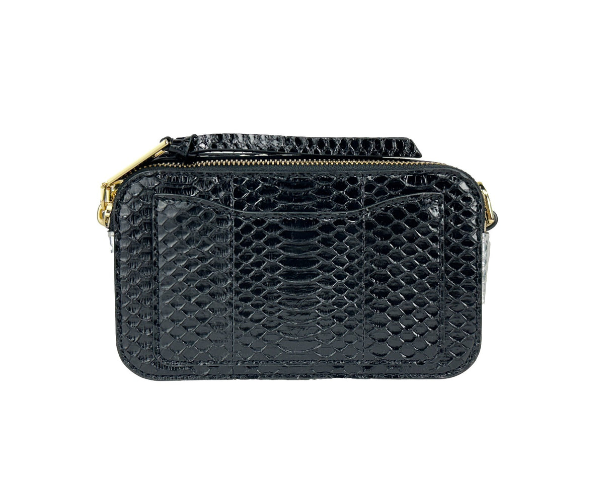 Discover the Marc Jacobs The Snapshot Snake Skin Crossbody Bag, a blend of exquisite calfskin leather and sophisticated design, perfect for elevating any ensemble.