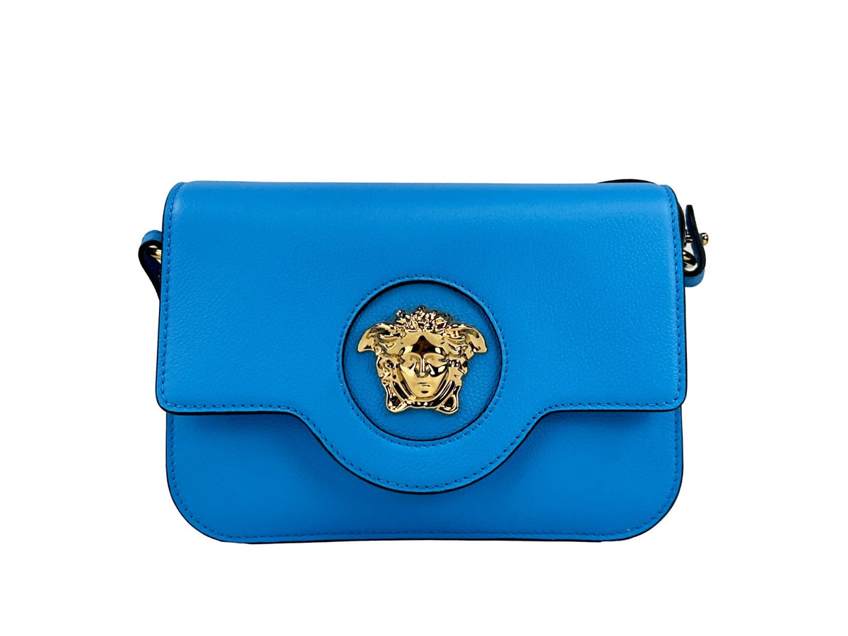 Indulge in the Versace La Medusa Blue Leather Shoulder Crossbody Bag, a masterpiece of Italian craftsmanship that elevates your style with its luxurious pebbled finish and gold accents.